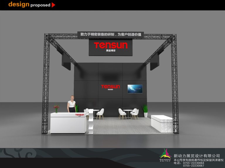 Exhibition booth design from the front, featuring a large black wall with a screen, a white reception desk with a mannequin, and a seating area.