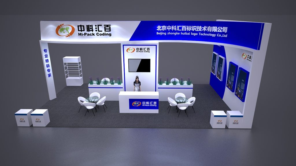 A sleek white and blue exhibition booth, featuring a central reception counter with an attendant and screen, two seating areas, and product displays on the walls.