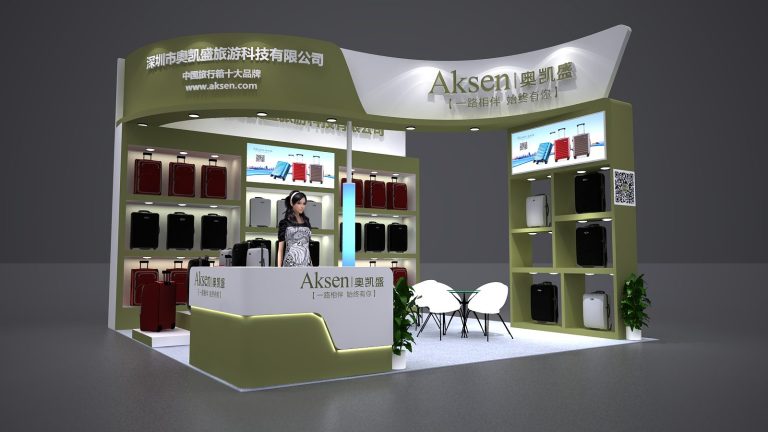 A 3D render of a green and white trade show booth showcasing numerous suitcases on shelves. A woman stands at a reception desk, with tables and chairs nearby.