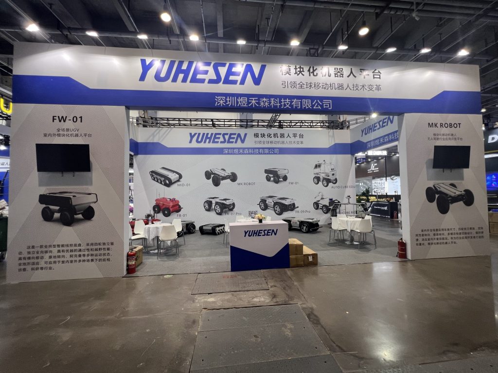 Wide view of expo booth displaying multiple robotic vehicles.