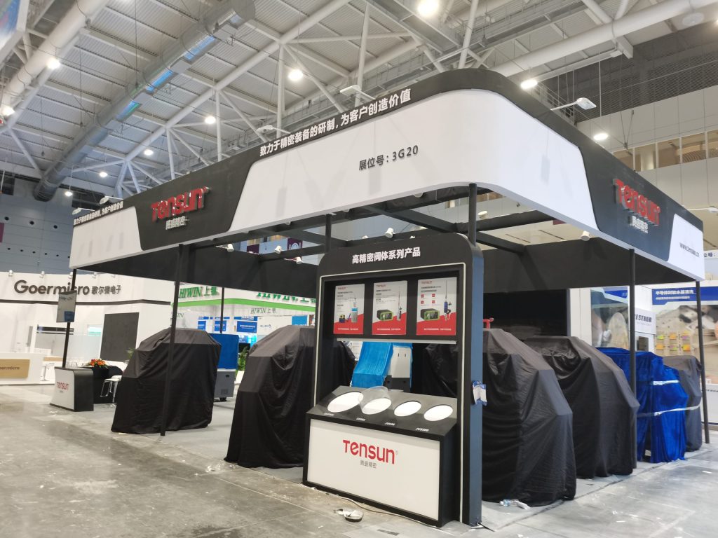 Exhibition booth construction: covered equipment, info display.