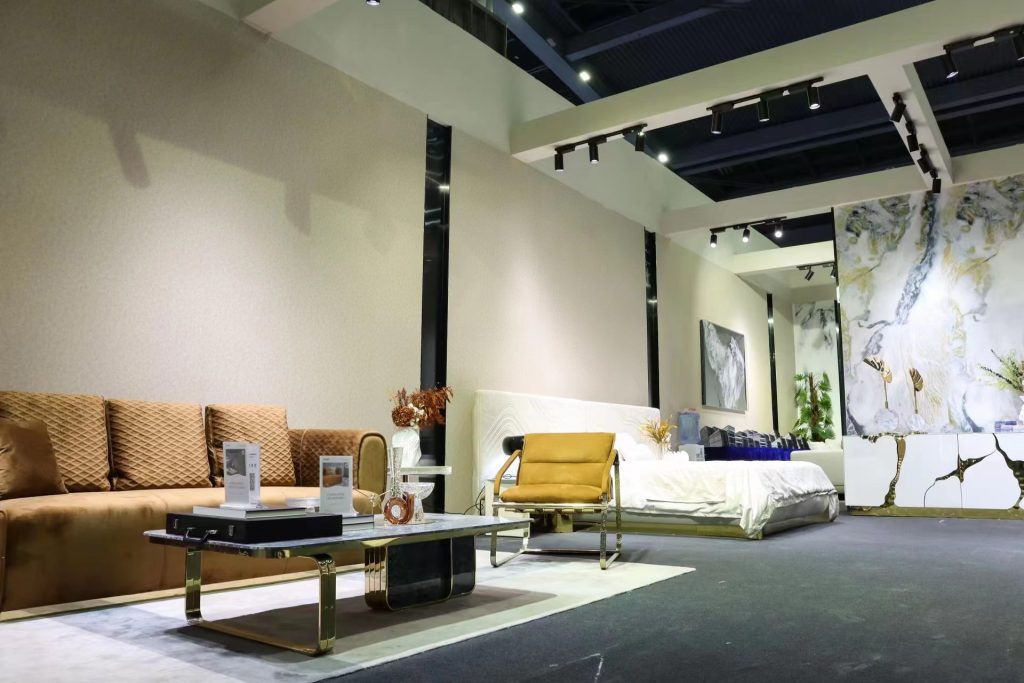 tan sofa, coffee table, bed, abstract cabinet.