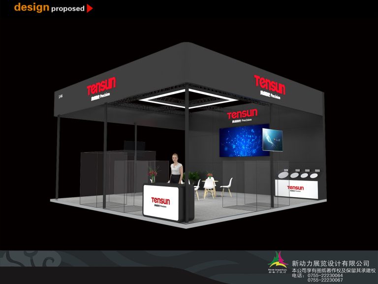 Another angle of the modern black exhibition booth, showing a reception desk, seating, and screens.