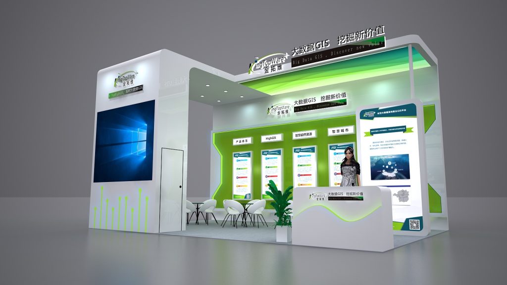 A digital rendering of a white and green exhibition booth, featuring a large screen displaying software, multiple information screens, a seating area, and a reception desk.