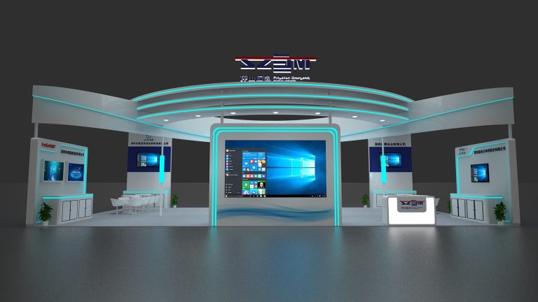 Front view of a white, futuristic trade show booth with blue accent lighting. A large central screen shows a Windows desktop, flanked by smaller screens and seating.