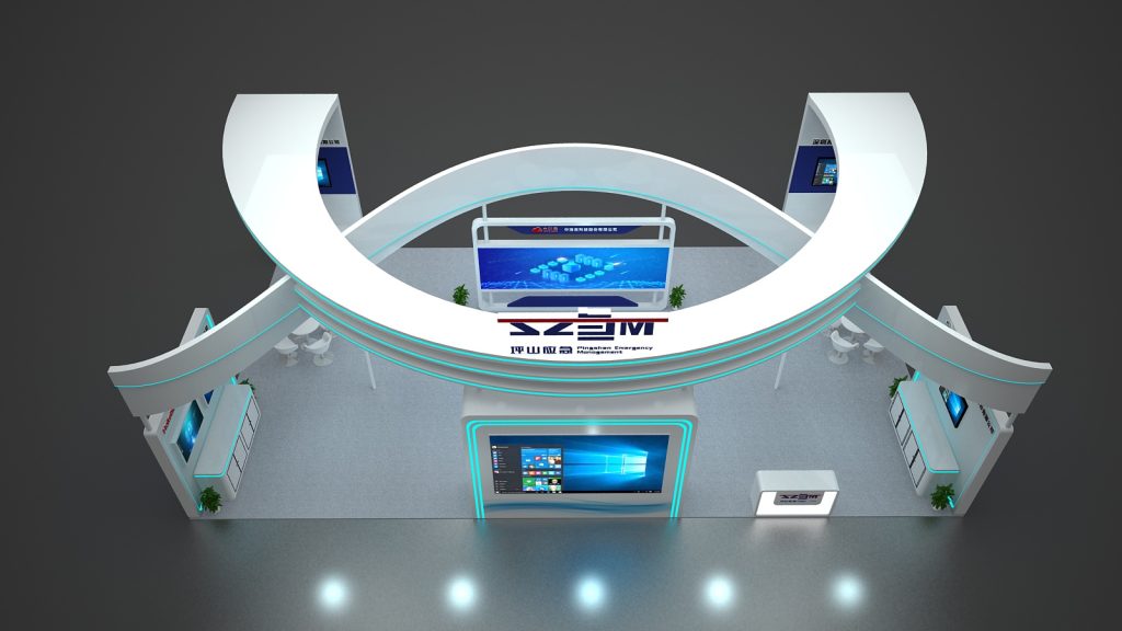 Overhead view of a U-shaped trade show booth with white structures and blue illumination. Multiple screens display visuals, and seating areas are visible on the grey floor.