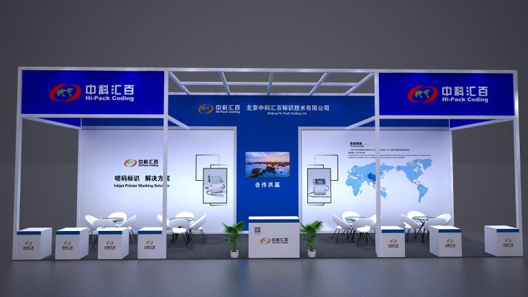 Front view of a blue and white trade show booth, featuring product screens, a world map, and several white seating arrangements.