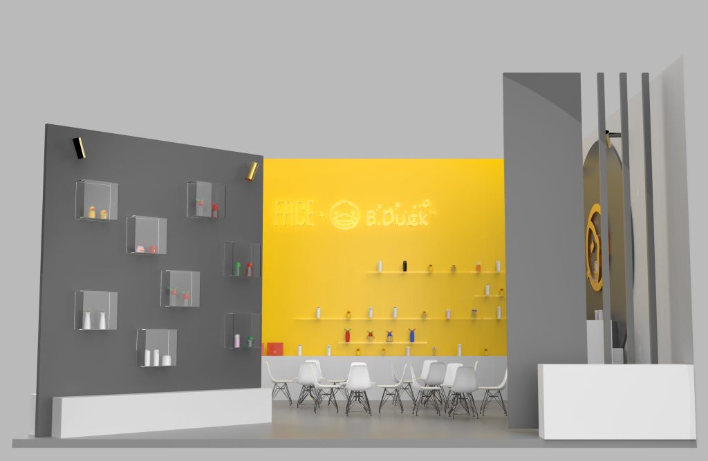 Booth with grey display cases, yellow product wall with neon sign, and white seating.