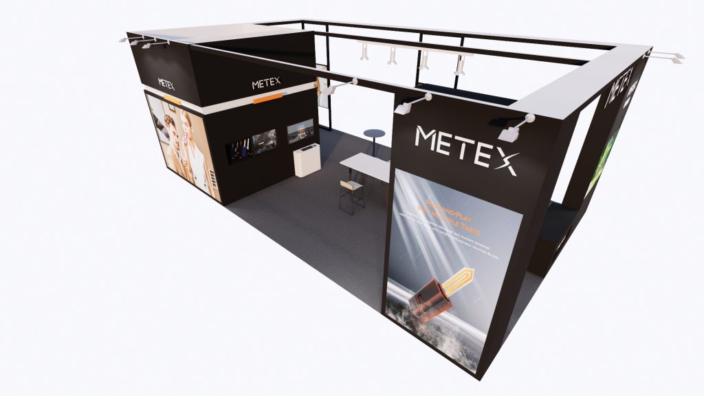 An overhead 3D render of a black exhibition booth, featuring large display screens, seating, and a glowing orange product visual.