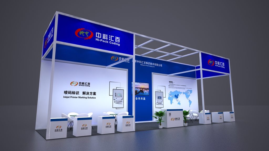 Side view of a blue and white trade show booth, displaying product information, a world map, and organized seating.