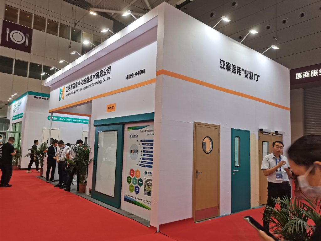 Side view of white booth showing various doors.