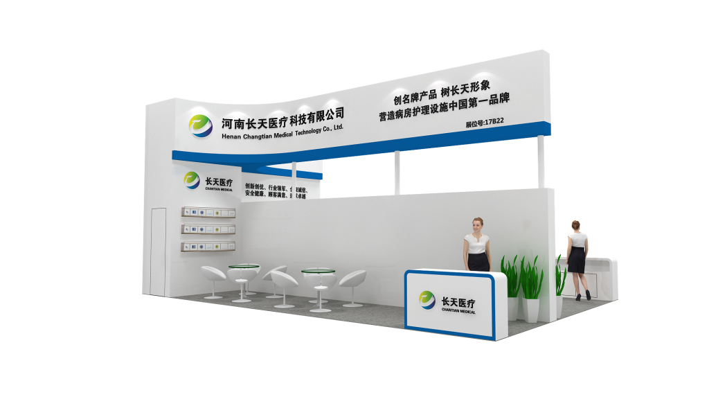 White and green trade show booth with a reception desk, a staff member, and a lounge area with round tables and chairs. Display panels are on the back wall.