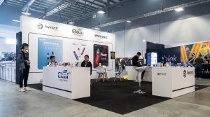new zealand exhibition booth builder NeoBooths designed Joyetech Eleaf Wismec e-cigarette vape brand stand at Auckland New Zealand trade fair with three-counter layout and customer demo area