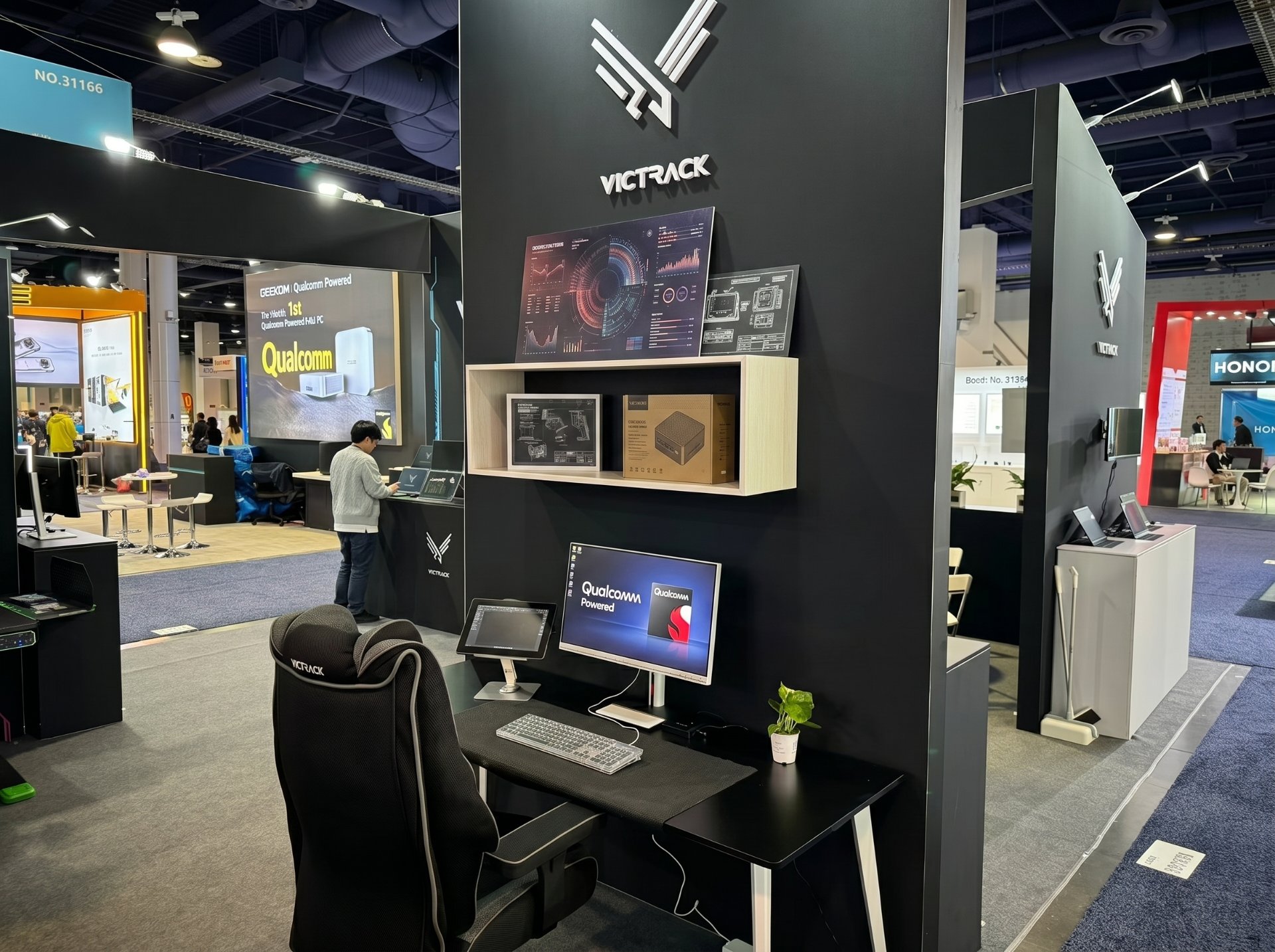 product demo wall and meeting area inside a custom CES booth