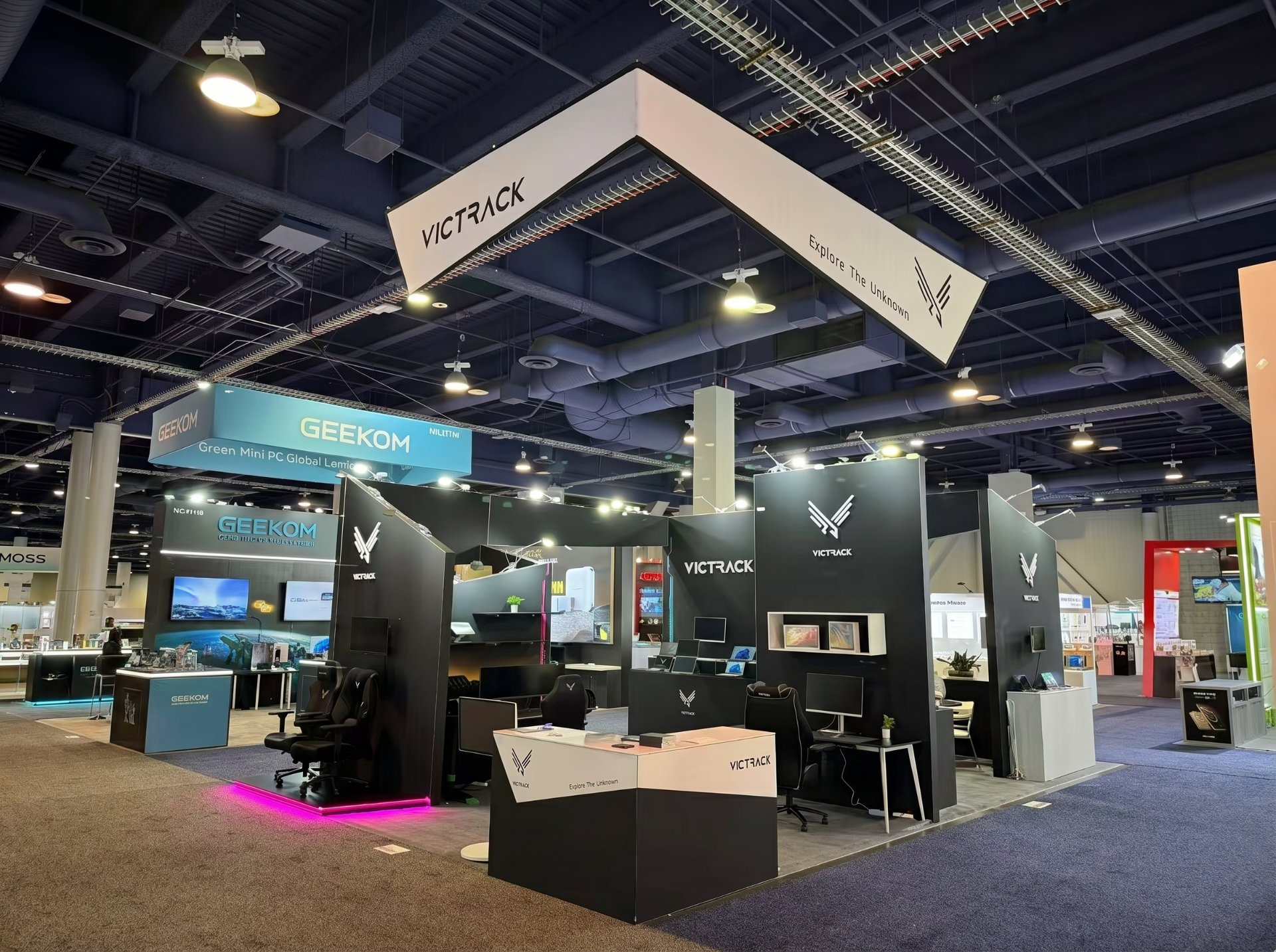 custom island booth with hanging lightbox banner at CES Las Vegas