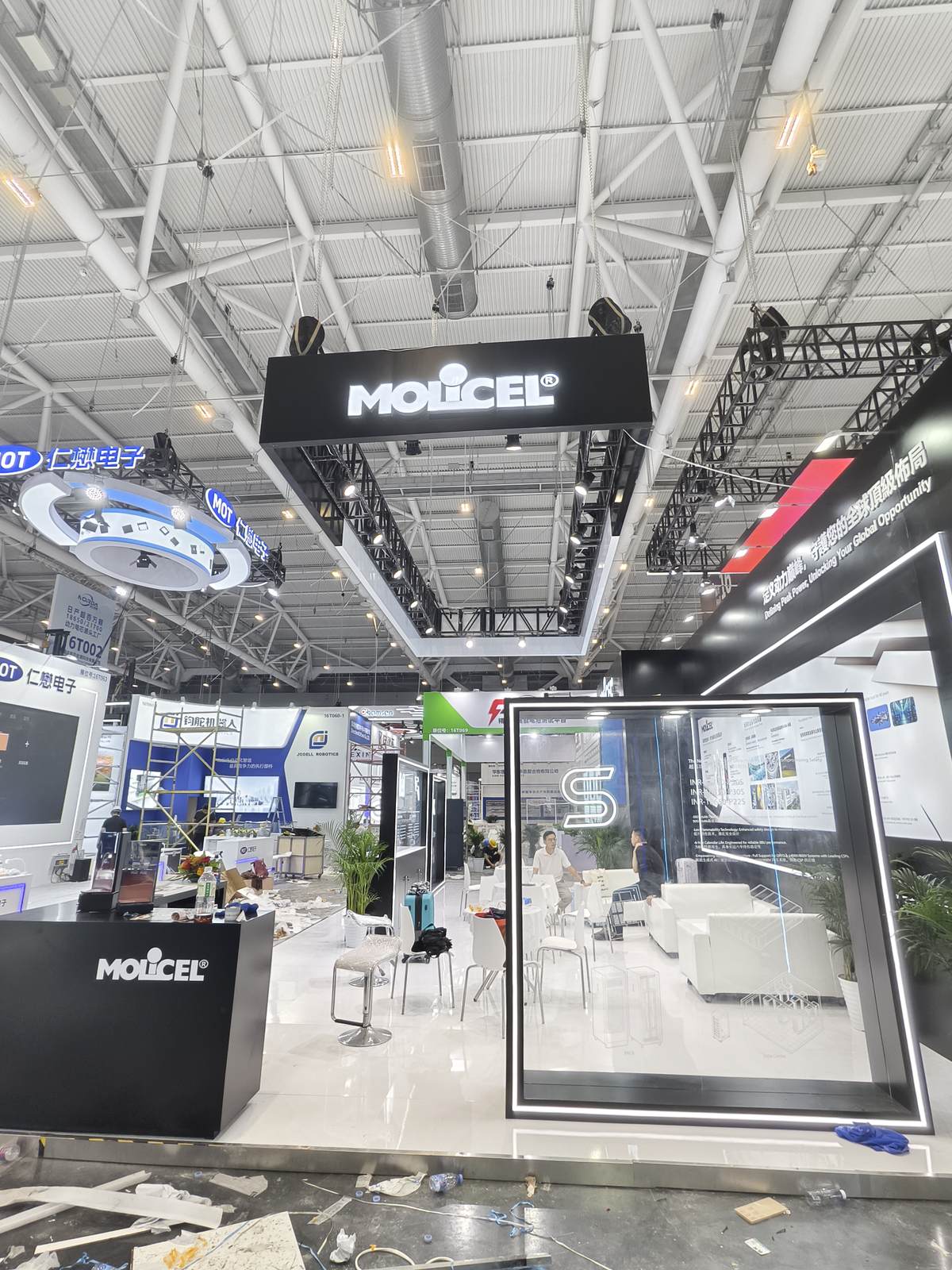 island booth with hanging banner at a Chinese trade show venue