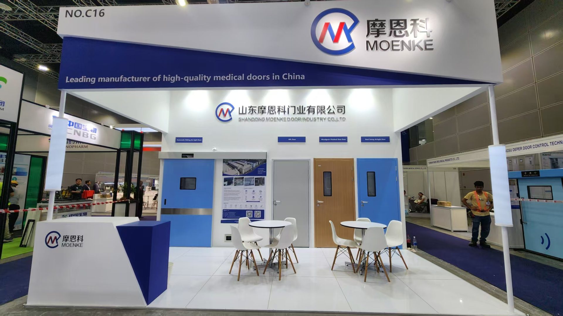 wide view of a custom trade show booth with meeting tables in Kuala Lumpur