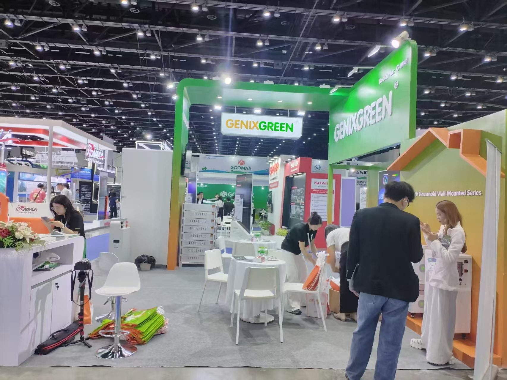 custom exhibition booth with green arch at a trade show in Thailand
