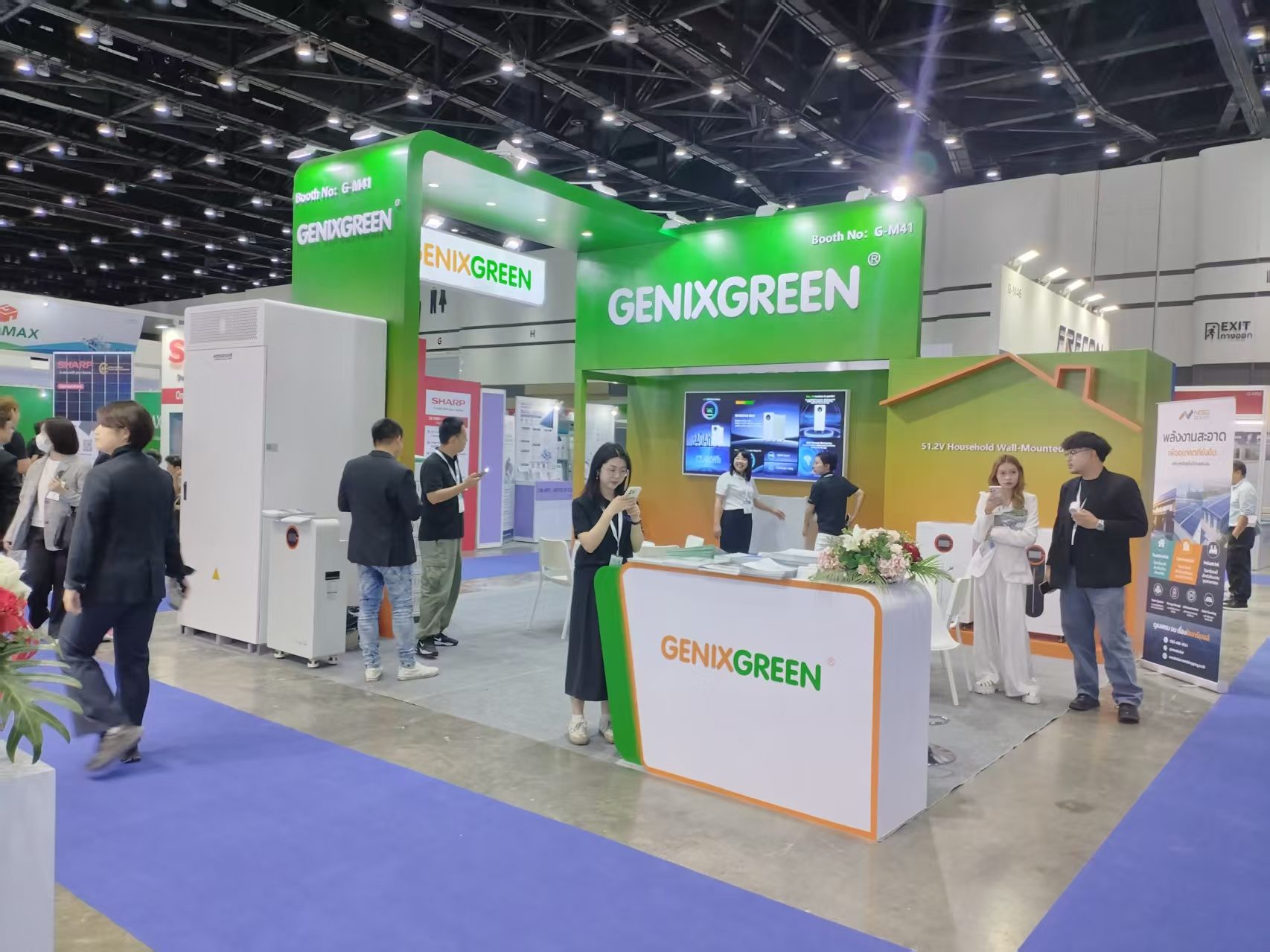 exhibition booth reception counter with visitors at a Thai trade show