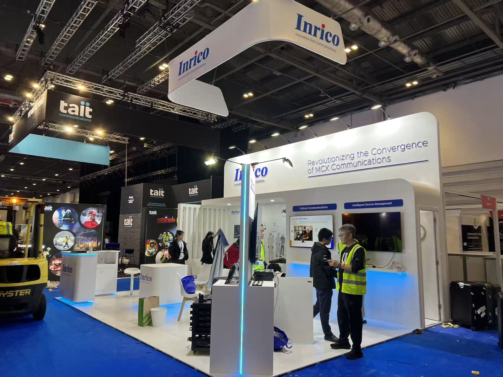 island exhibition stand with illuminated counter at a UK exhibition hall